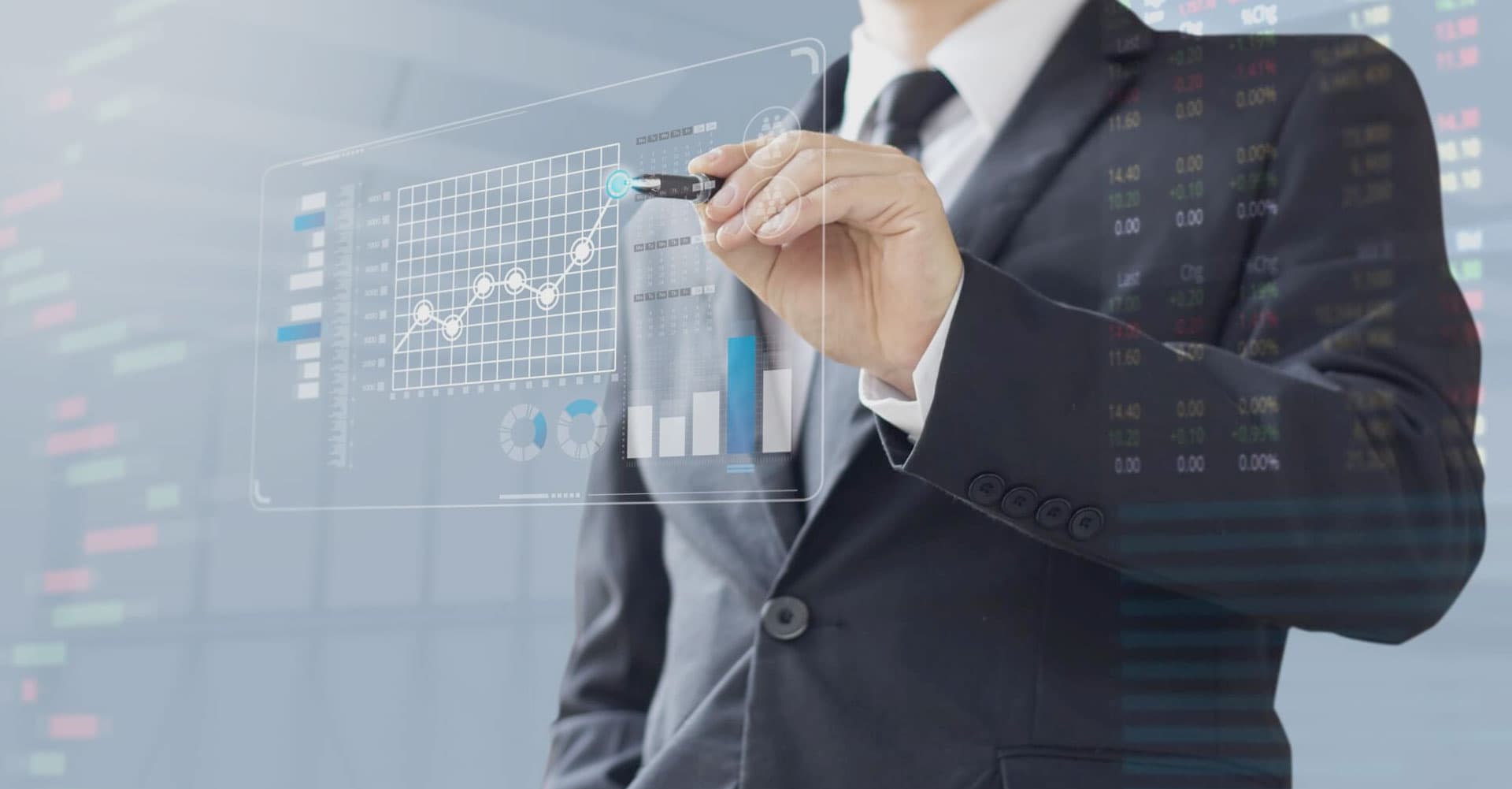 Businessman reviewing financial charts on a digital tablet